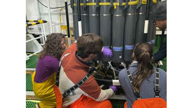 Dr. Brandi Kiel Reese, Caleb Boyd, Hannah Organ (Texas A&M University-Corpus Christi), and Dr. Kanchan Maiti (Louisiana State University) taking water samples from the CTD.